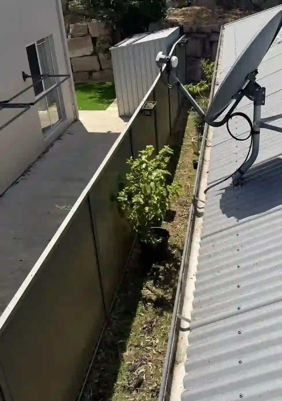 After gutter cleaning - Debris and silt removed, free-flowing again