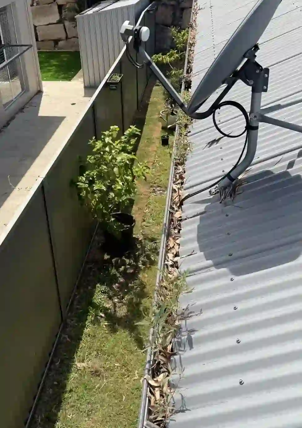 Before gutter cleaning - Debris and silt removed, free-flowing again